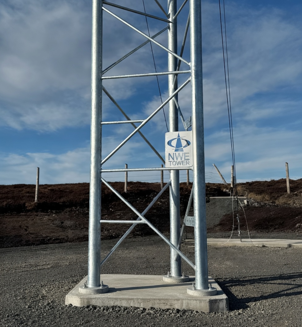 NWE Tower - Galvanised steel lattice tower structure with NWE Tower sign
